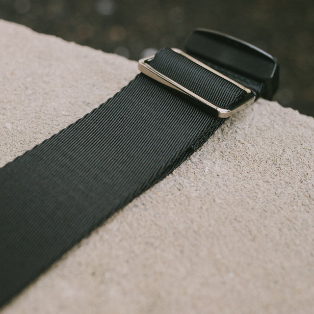 Detailed shot of the metal hardware and nylon strap for the Honeypie Bum Bag